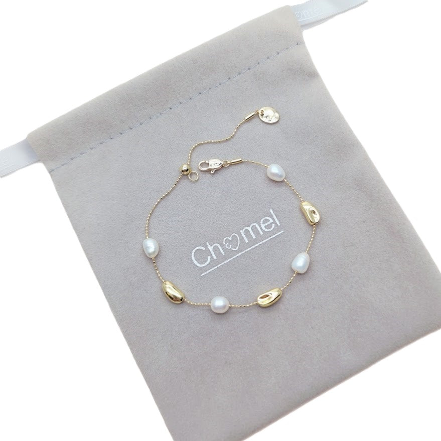 Freshwater Pearl Bracelet featuring white freshwater pearls and gold-plated beads on an adjustable delicate gold chain