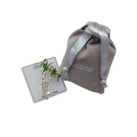 Gold-plated palm trees brooch with green enamel leaves, cubic zirconia accents, and 8mm freshwater pearl centerpiece