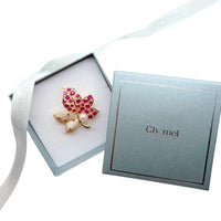Gold plated flower freshwater pearl brooch with cubic zirconia and red stone maple leaf design