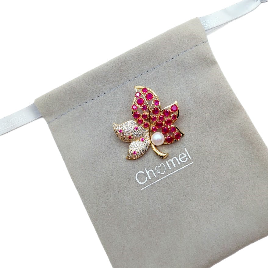 Gold plated flower freshwater pearl brooch with cubic zirconia and red stones, featuring an 8mm button freshwater pearl