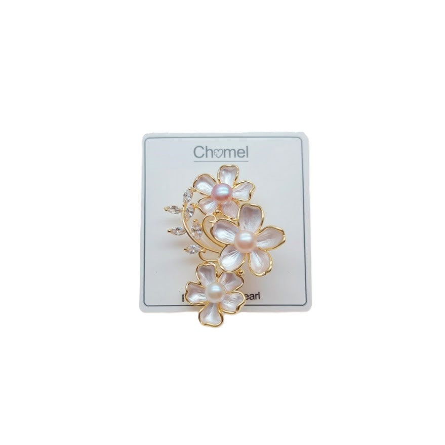 Flower Freshwater Pearl Brooch with white enamel petals, gold-toned outlines, round pearls and sparkling crystal accents.