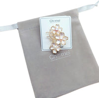 Flower Freshwater Pearl Brooch with gold-tone flower outlines, pale pink enamel petals, lustrous pearls and sparkling accents.
