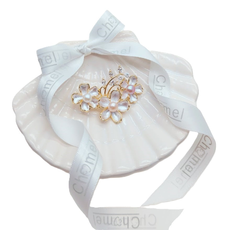Flower Freshwater Pearl Brooch in gold-tone metal, with iridescent enamel flowers, round pearls and sparkling clear stones.