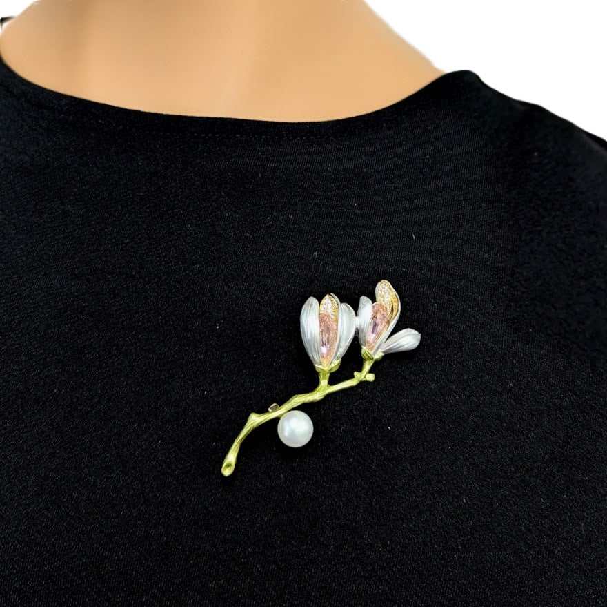 Flower Freshwater Pearl Brooch with gold-tone branch, pale enamel petals, pink accents, and a round white pearl.