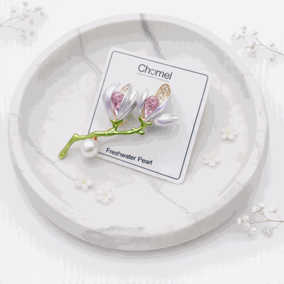 Flower Freshwater Pearl Brooch with lilac enamel petals, pink and gold accents, green stem and round white pearl.