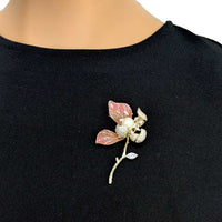 Flower Freshwater Pearl Brooch with pink enamel petals, gold-tone stem, sparkling clear stones and a central pearl.