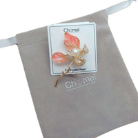 Flower Freshwater Pearl Brooch with coral pink enamel petals, a central pearl, gold-tone stem and sparkling crystal accents.