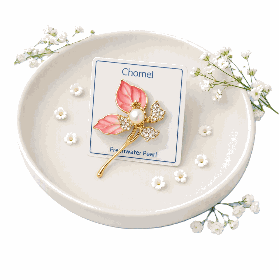Flower Freshwater Pearl Brooch with pink enamel petals, gold-tone stem, sparkling clear stones and a central white pearl.