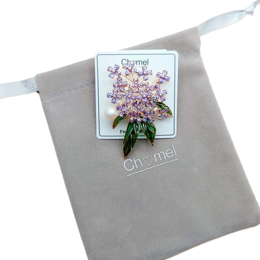 Flower Freshwater Pearl Brooch with gold-tone clustered purple crystal flowers, green enamel leaves and a white pearl accent.