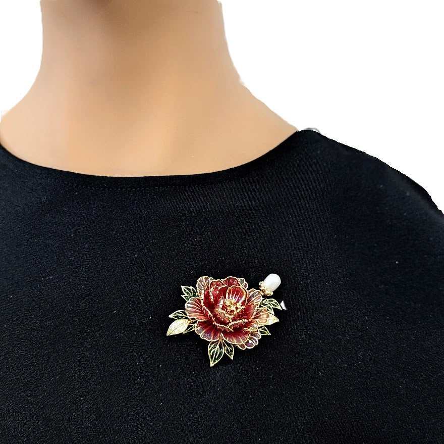 Flower Freshwater Pearl Brooch with a red enamel flower, green leaves, gold-tone outlines, and a white pearl accent.