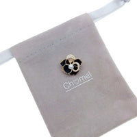 Gold plated flower freshwater pearl brooch with enamel petals and central 4-5mm pearl, 2cm diameter.