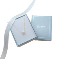 Freshwater Pearl Necklace with a single white pearl on a delicate gold-plated chain presented in a blue gift box