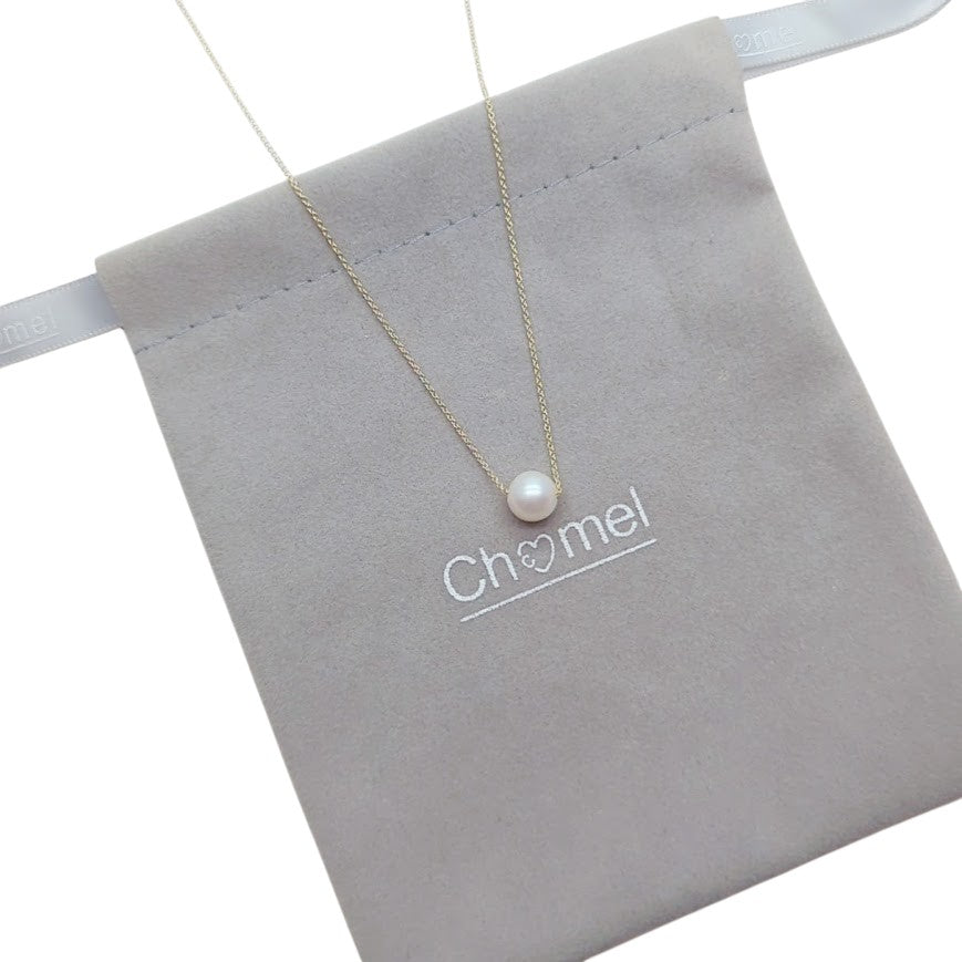 Freshwater Pearl Necklace featuring a single white pearl on a delicate gold-plated chain with an adjustable clasp.