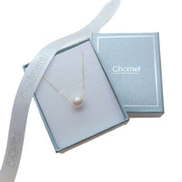 Freshwater Pearl Necklace with a single lustrous white pearl on a delicate gold-plated chain in a blue gift box.