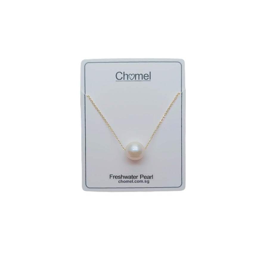 Freshwater Pearl Necklace with a single lustrous white pearl on a delicate gold plated chain displayed on a white card.