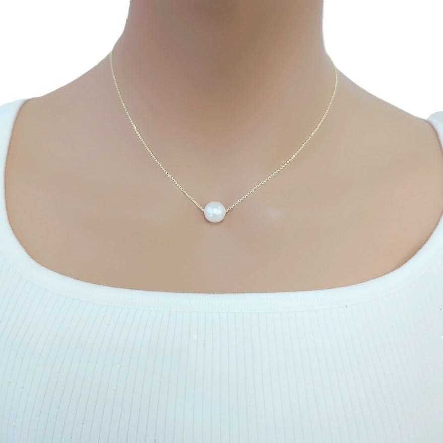 Freshwater Pearl Necklace with a single lustrous white pearl on a delicate gold-plated chain worn on the neck