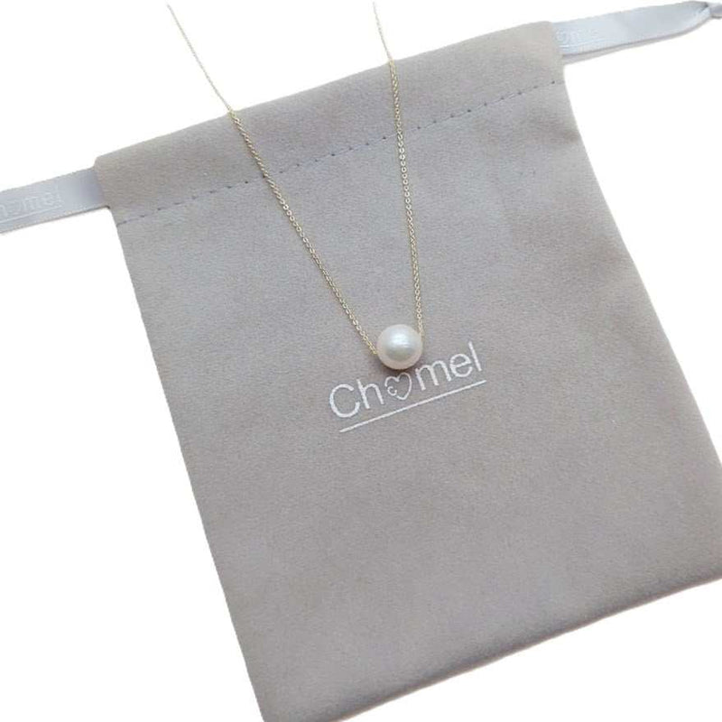 Freshwater Pearl Necklace with a single white pearl on a delicate gold-plated chain displayed on a soft grey pouch.