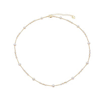 Freshwater Pearl Necklace featuring small and medium white roundish pearls on delicate gold-plated filigree wire with adjustable clasp