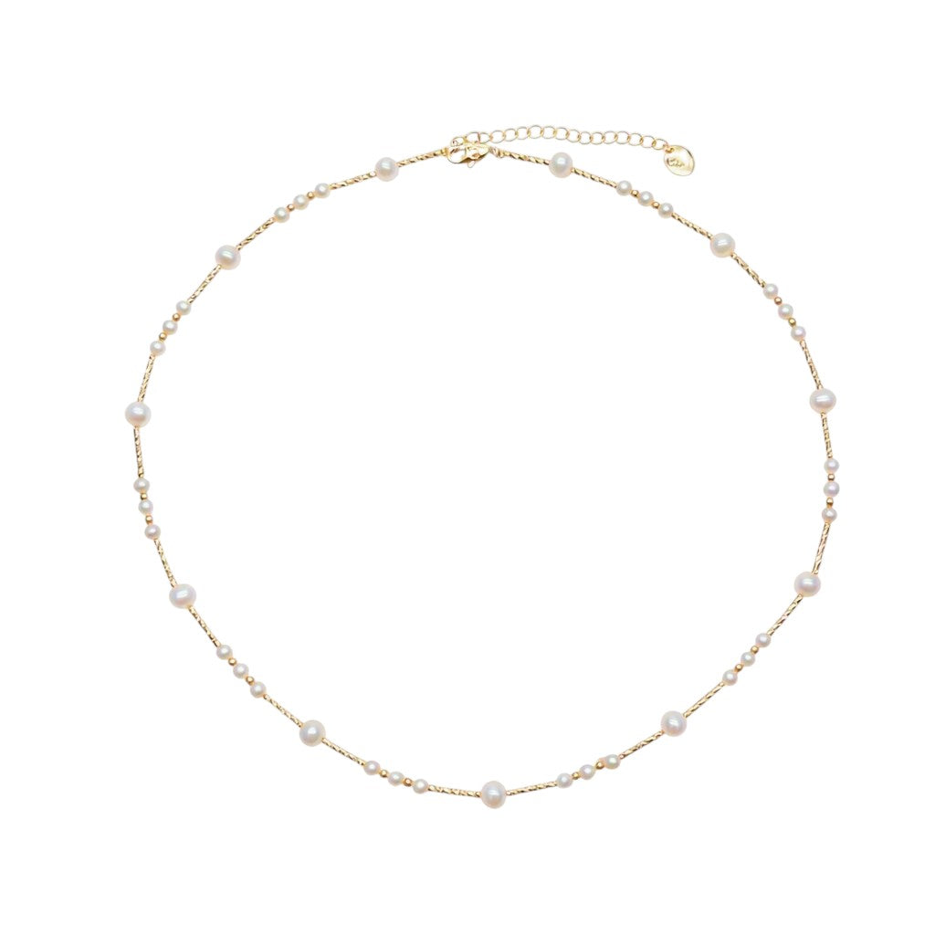 Freshwater Pearl Necklace featuring small and medium white roundish pearls on delicate gold-plated filigree wire with adjustable clasp