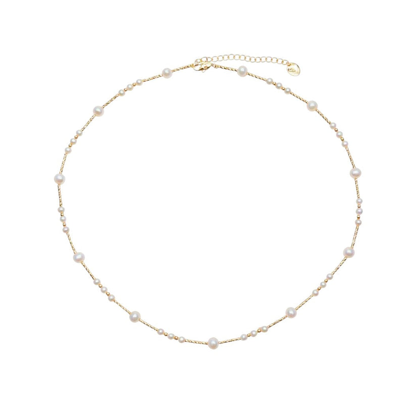 Freshwater Pearl Necklace featuring small and medium white roundish pearls on delicate gold-plated filigree wire with adjustable clasp