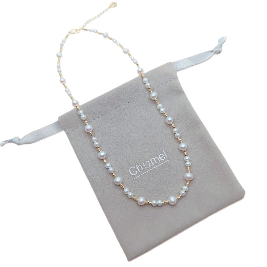 Freshwater Pearl Necklace with roundish white pearls and gold-plated beads on delicate wire with adjustable clasp