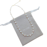 Freshwater Pearl Necklace with roundish white pearls and gold-plated beads on delicate wire with adjustable clasp