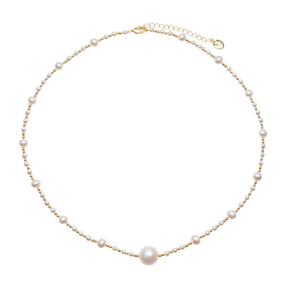 Freshwater Pearl Necklace featuring a large 11mm white pearl centerpiece with smaller roundish pearls and gold-plated beads on delicate wire.