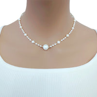 Freshwater Pearl Necklace featuring white round freshwater pearls with an 11mm centerpiece and gold-plated beads on wire choker