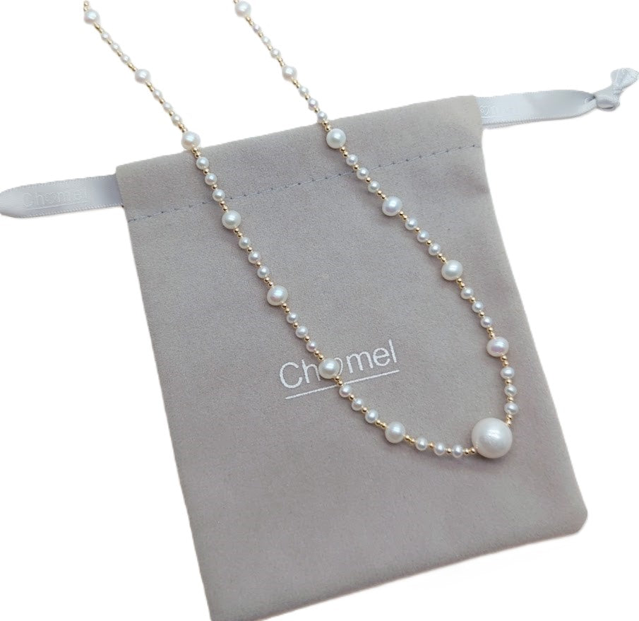 Freshwater Pearl Necklace with white freshwater pearls and gold-plated beads on delicate wire, featuring an 11mm pearl centerpiece