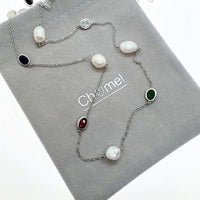 Freshwater Pearl Rhodium Chain necklace with silver-tone links, irregular white pearls and oval coloured stones.