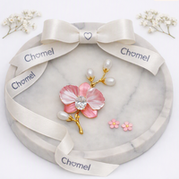 Flower Freshwater Pearl Brooch with a pink enamel bloom, clear crystal centre, white faux pearls and gold-tone branch.