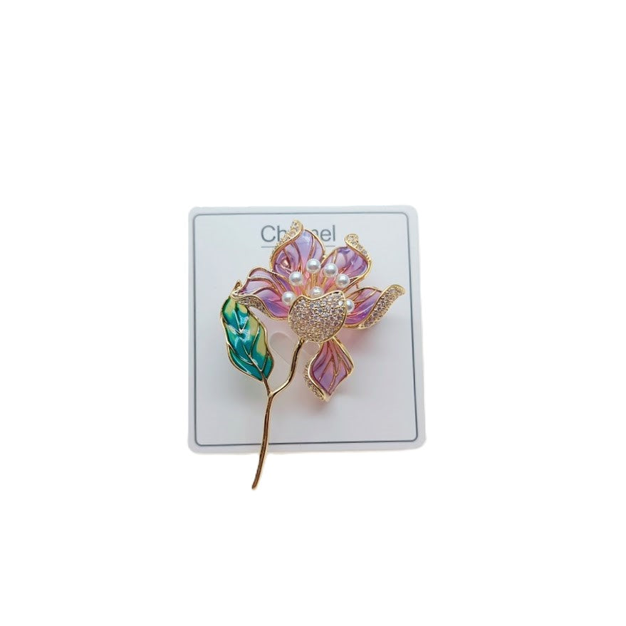 Flower Freshwater Pearl Brooch with translucent purple enamel petals, pearl accents, teal leaf and gold-tone stem.
