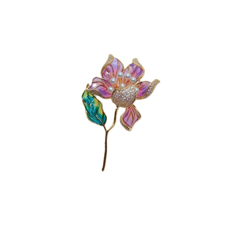 Flower Freshwater Pearl Brooch with a purple enamel bloom, pearly centre, green leaf and slender gold-tone stem.