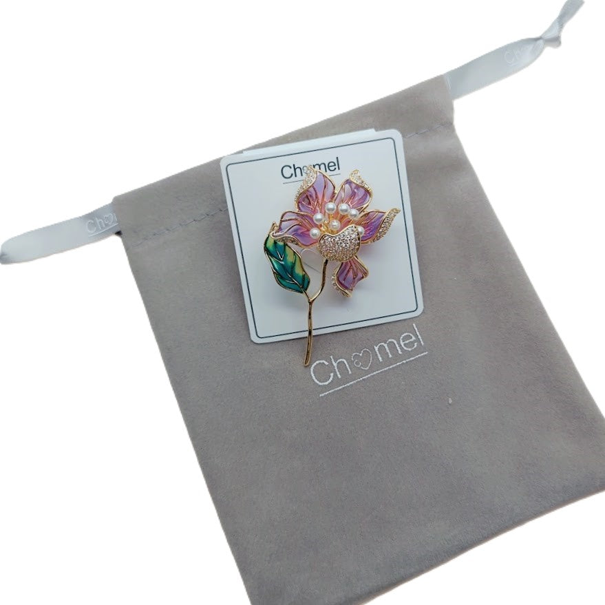Flower Freshwater Pearl Brooch with purple enamel petals, a clustered pearl centre, green leaf and gold-tone stalk