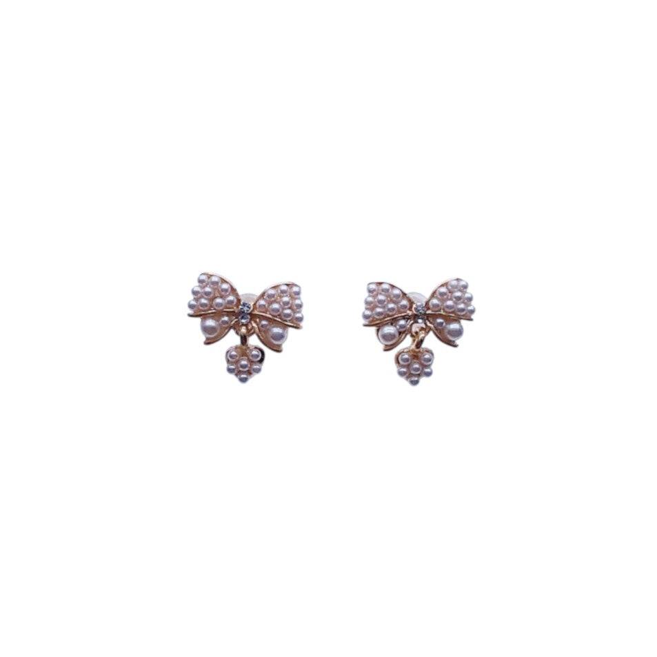 Gold plated ribbon simulated pearl earrings with small heart dangle and post backings