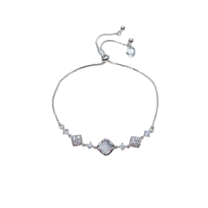 Cubic Zirconia Tennis Bracelet in silver-tone metal with a diamond-shaped simulated moonstone centre and sparkling accents