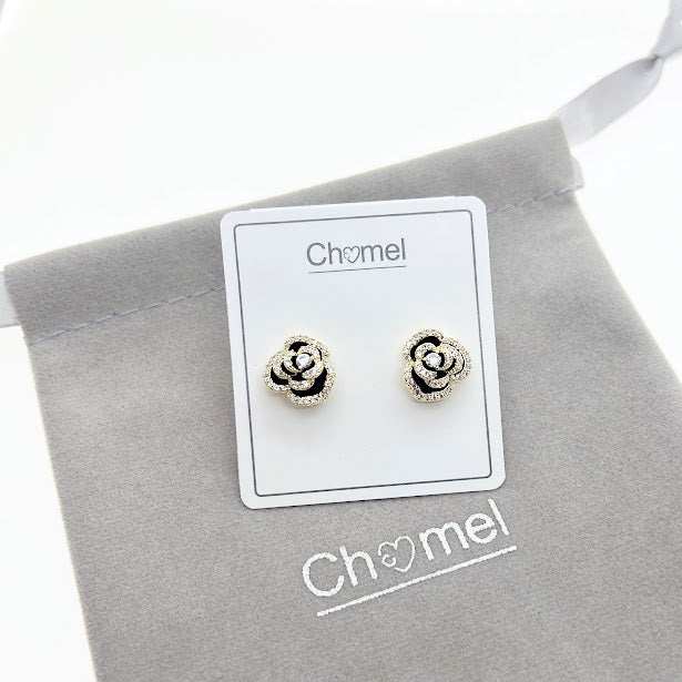 Black enamel flower cubic zirconia stud earrings with gold plated finish and hypoallergenic posts