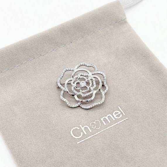 Flower cubic zirconia brooch with rose cutout design and rhodium plating, 3cm diameter, pin with C clasp closure