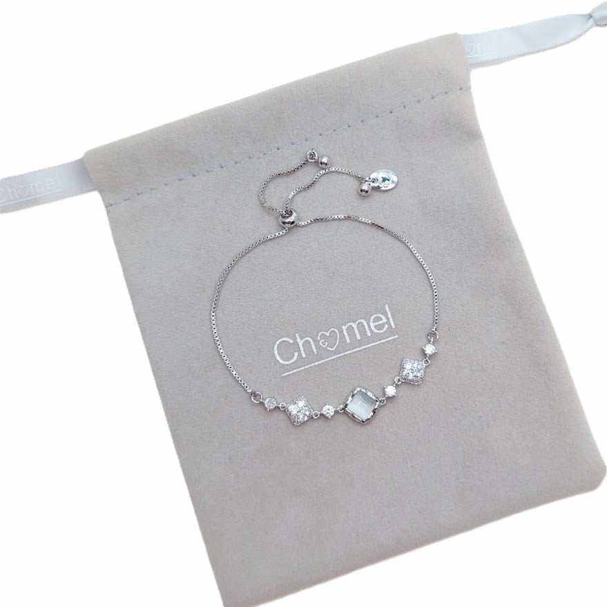bracelet for woman in silver-tone metal with clear geometric stones and an adjustable sliding chain