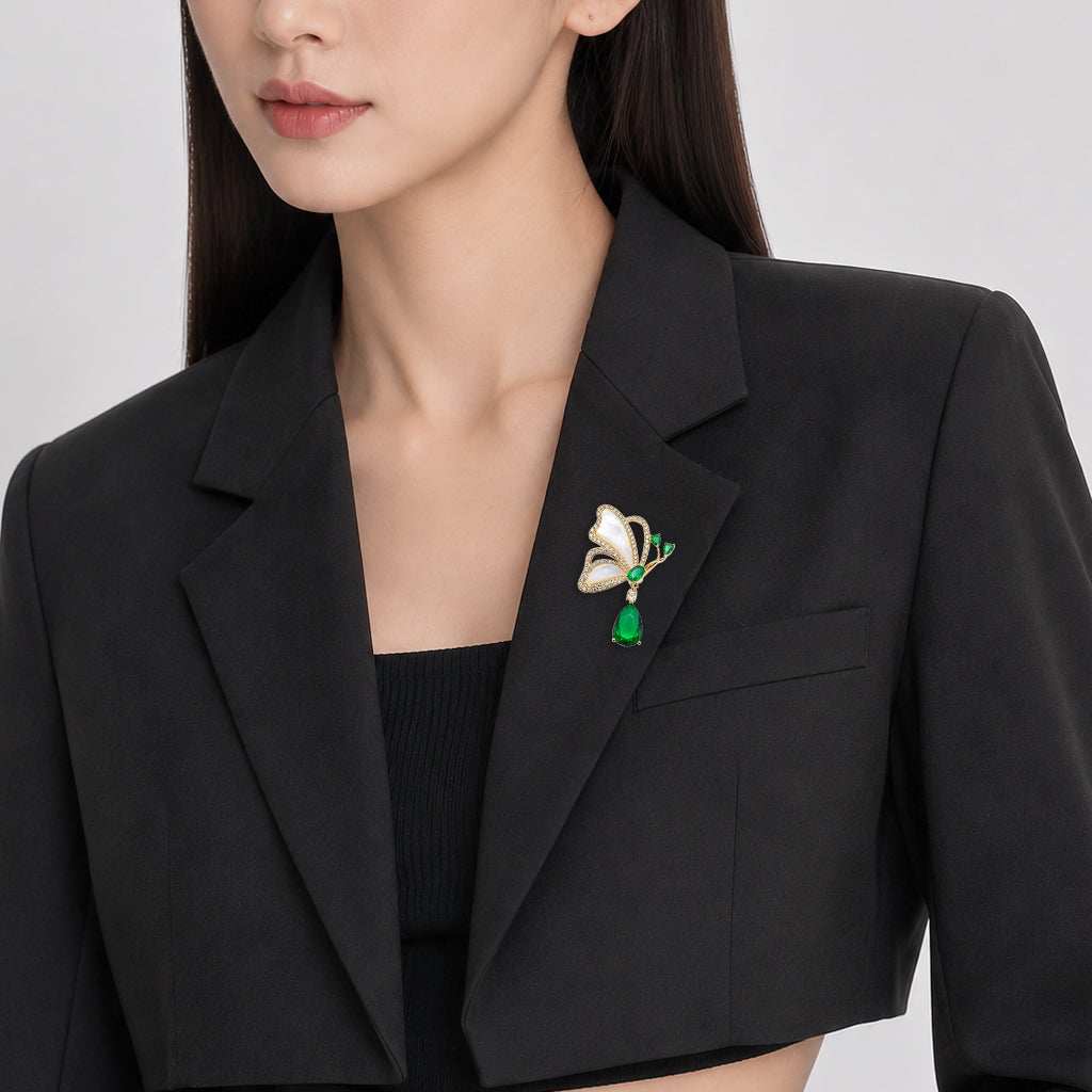 Butterfly cubic zirconia brooch with mother of pearl and green teardrop stone
