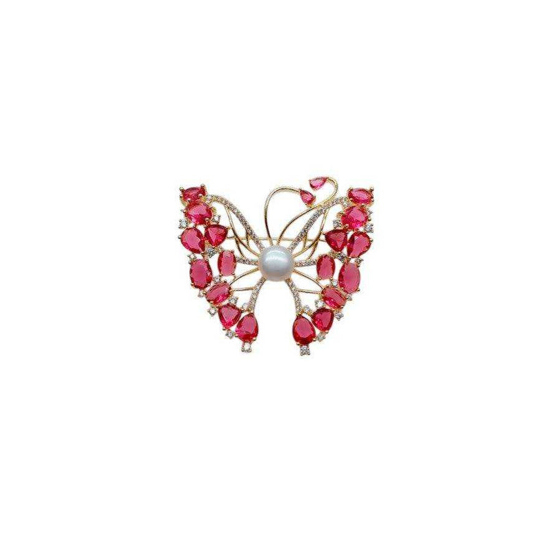 Butterfly brooch with cubic zirconia, red stones, and freshwater pearl