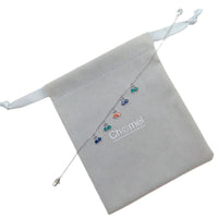 Cubic zirconia tennis bracelet with dangling colorful cherry charms and rhodium plated finish