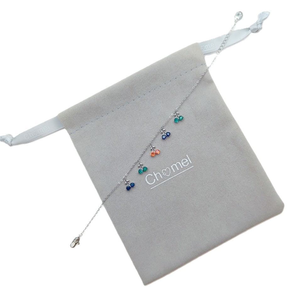 Cubic zirconia tennis bracelet with dangling colorful cherry charms and rhodium plated finish