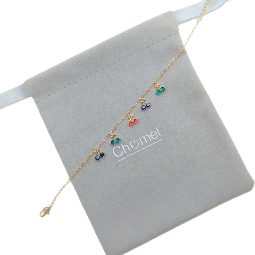 Gold-plated cubic zirconia tennis bracelet with dangling colorful cherry charms