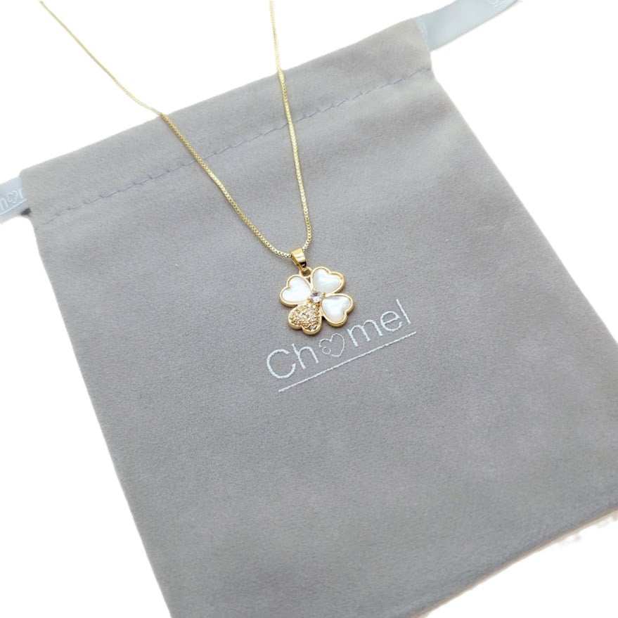 clover necklace with gold-tone chain and white mother-of-pearl petals, including one sparkling cubic zirconia petal