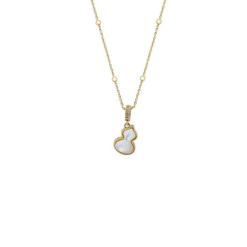 Gold-tone necklace with a delicate bead-accented chain, cubic zirconia-set clasp and white moonstone-shaped pendant; Dream Catcher Cubic Zirconia Necklace