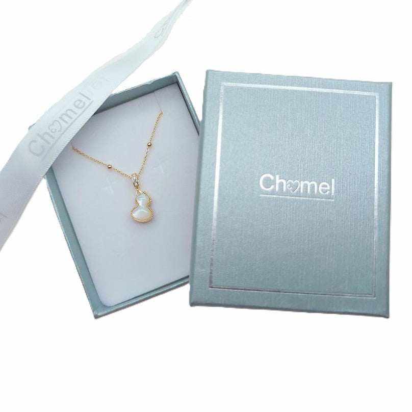 Dream Catcher Cubic Zirconia Necklace with a gold-tone fine chain and small pear-shaped white pendant edged in sparkle stones.