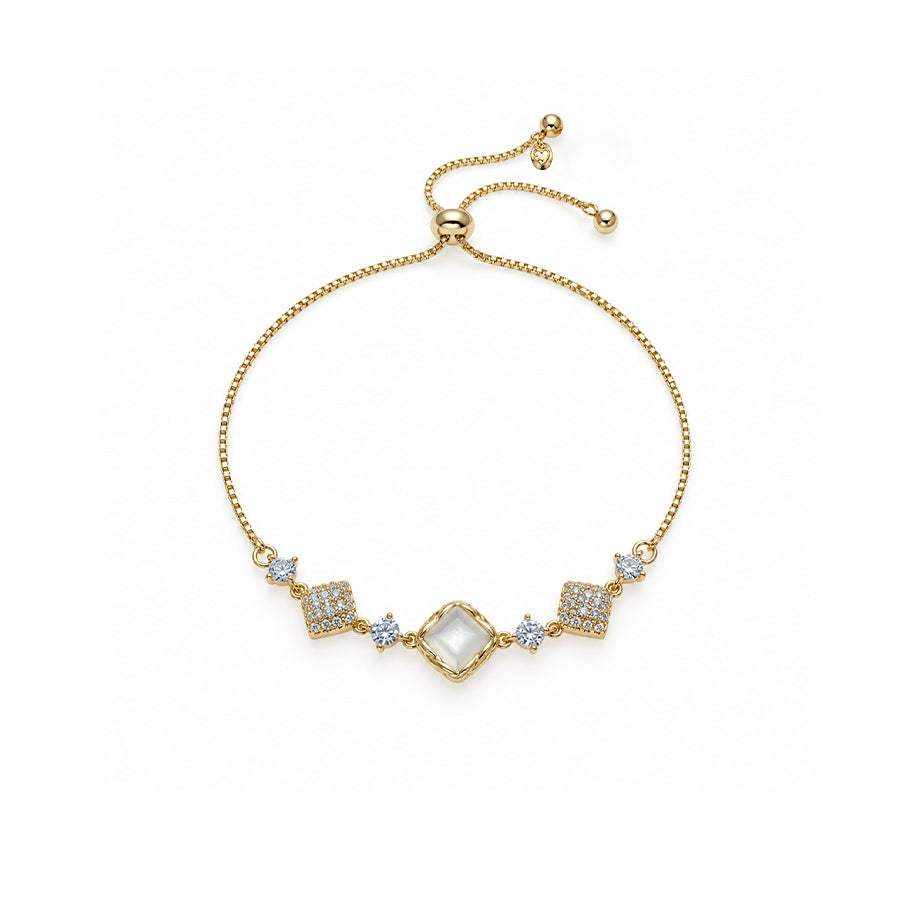 Cubic Zirconia Tennis Bracelet with a gold-tone adjustable chain, clear square centerpiece and sparkling geometric accents