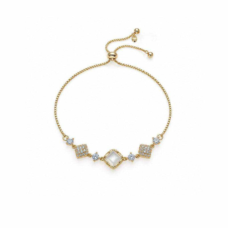 Cubic Zirconia Tennis Bracelet with a gold-tone adjustable chain, clear square centerpiece and sparkling geometric accents