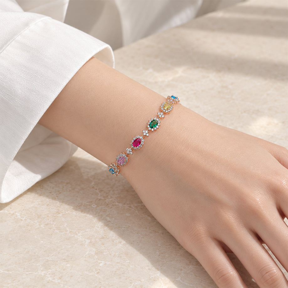 Rosegold plated cubic zirconia tennis bracelet with oval brilliant stones and small stone border, 16 cm length